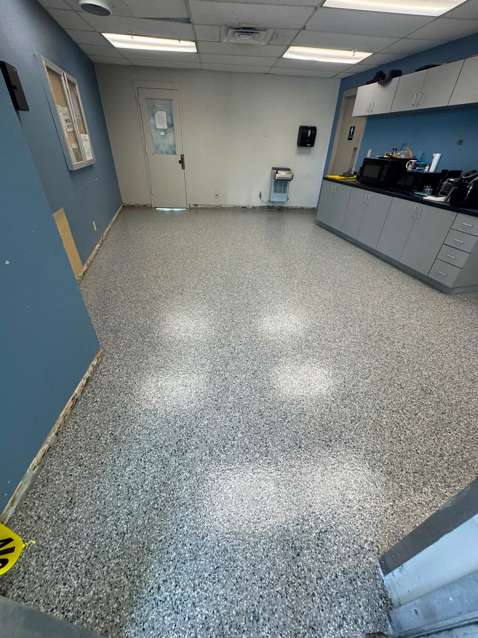 Gray flake epoxy floor in a commercial kitchen